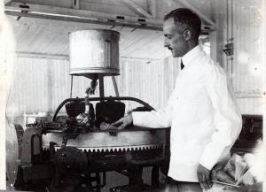 man standing next to cone machine
