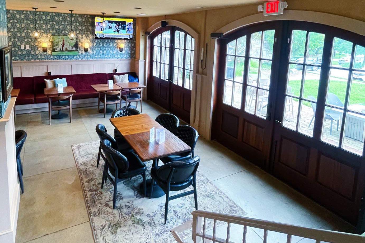 Cozy restaurant interior showcasing tables and chairs set for guests