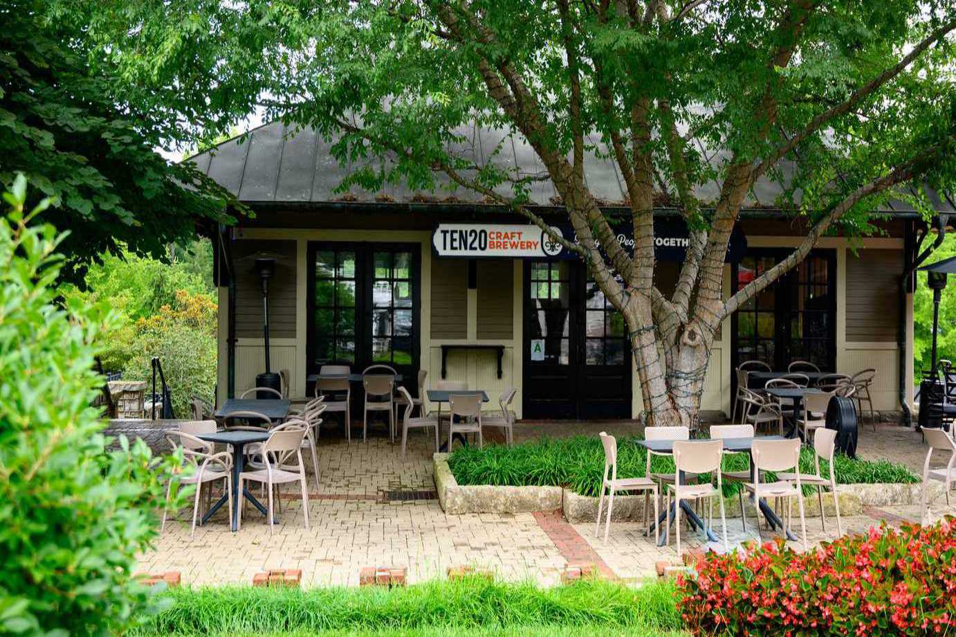 A scenic patio at TEN20 Anchorage, with plenty of greenery