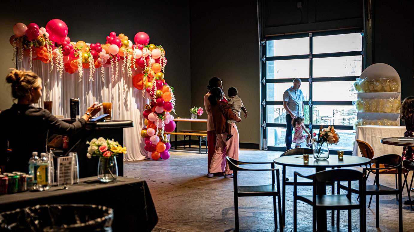 A large community room with vibrant balloons, perfect for events and celebrations