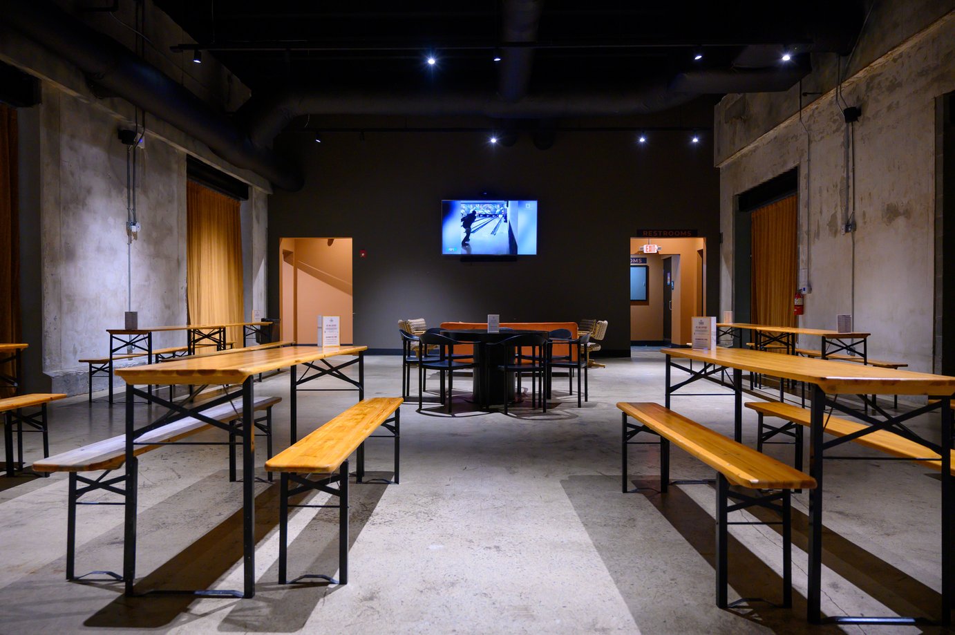 Interior lounge room with tables and benches