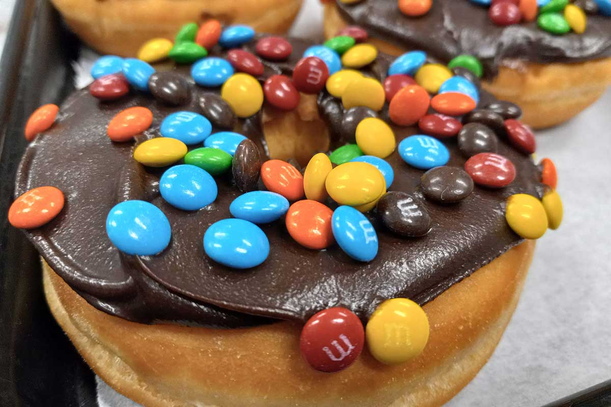 Donut with chocolate glaze and M&Ms