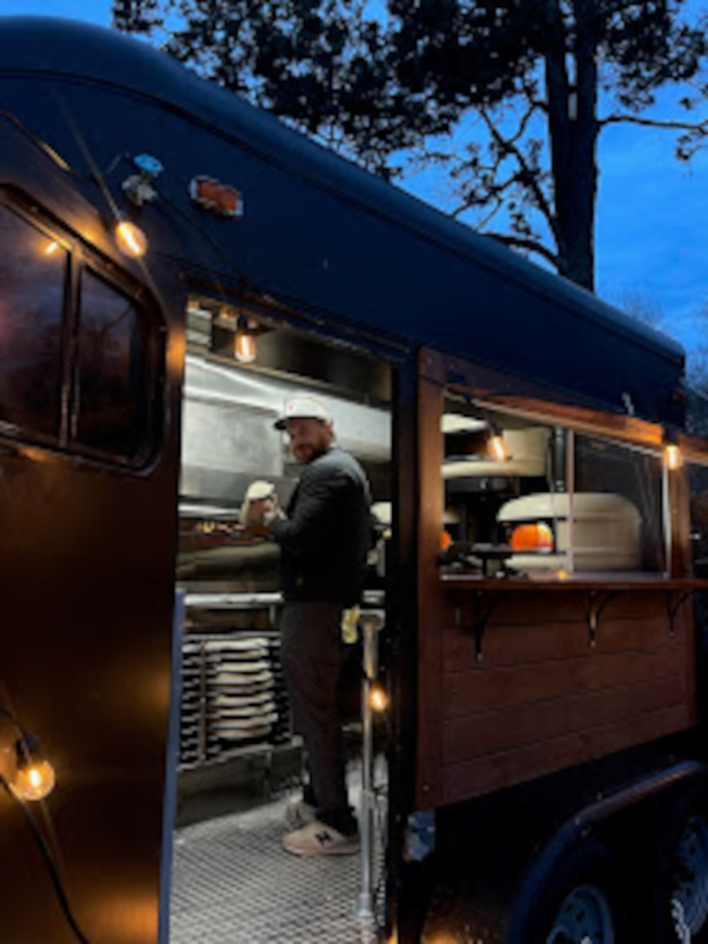 worker in a pizza truck