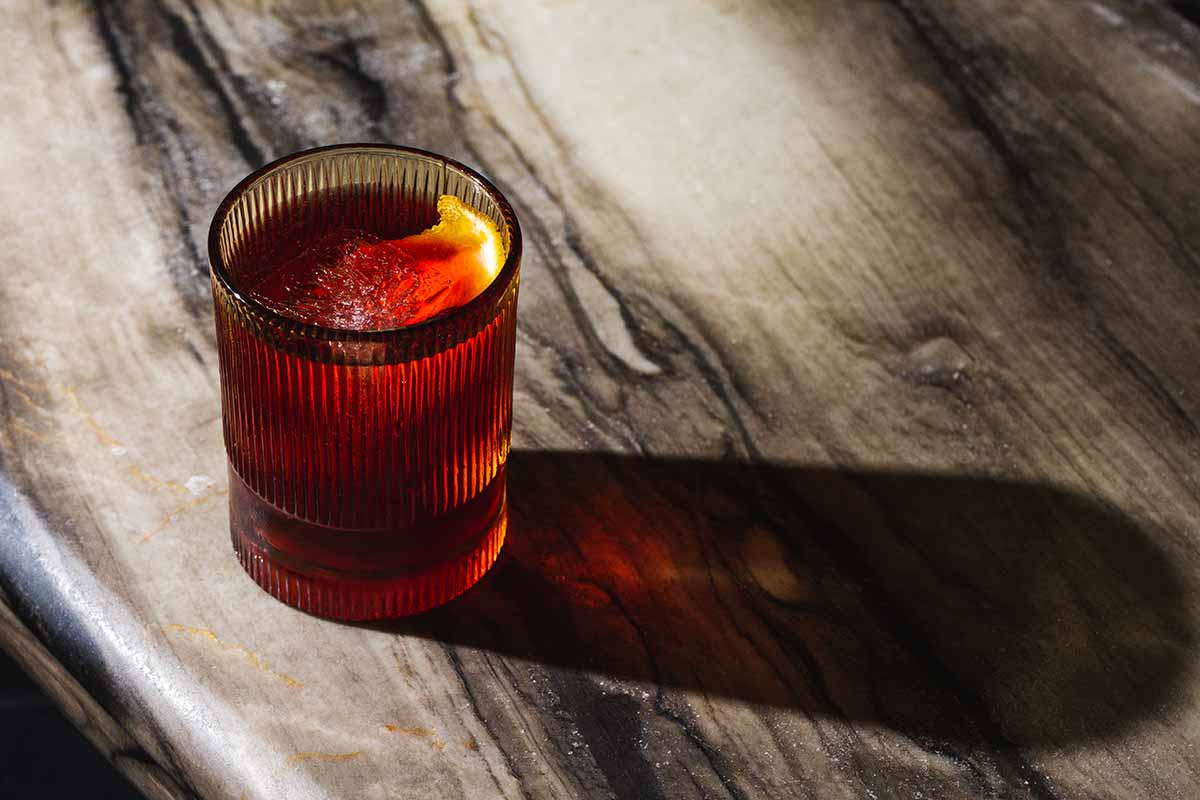 Bustan Negroni drink on the table