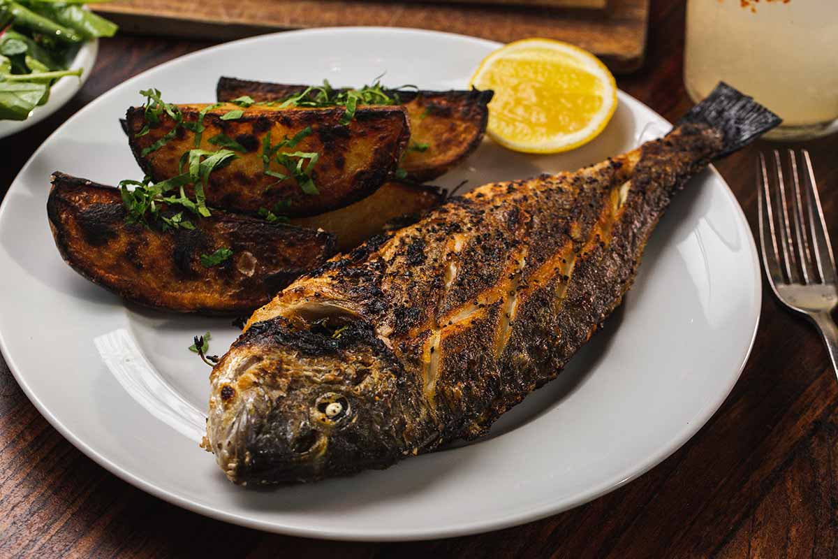 Whole Durade fish on the dish