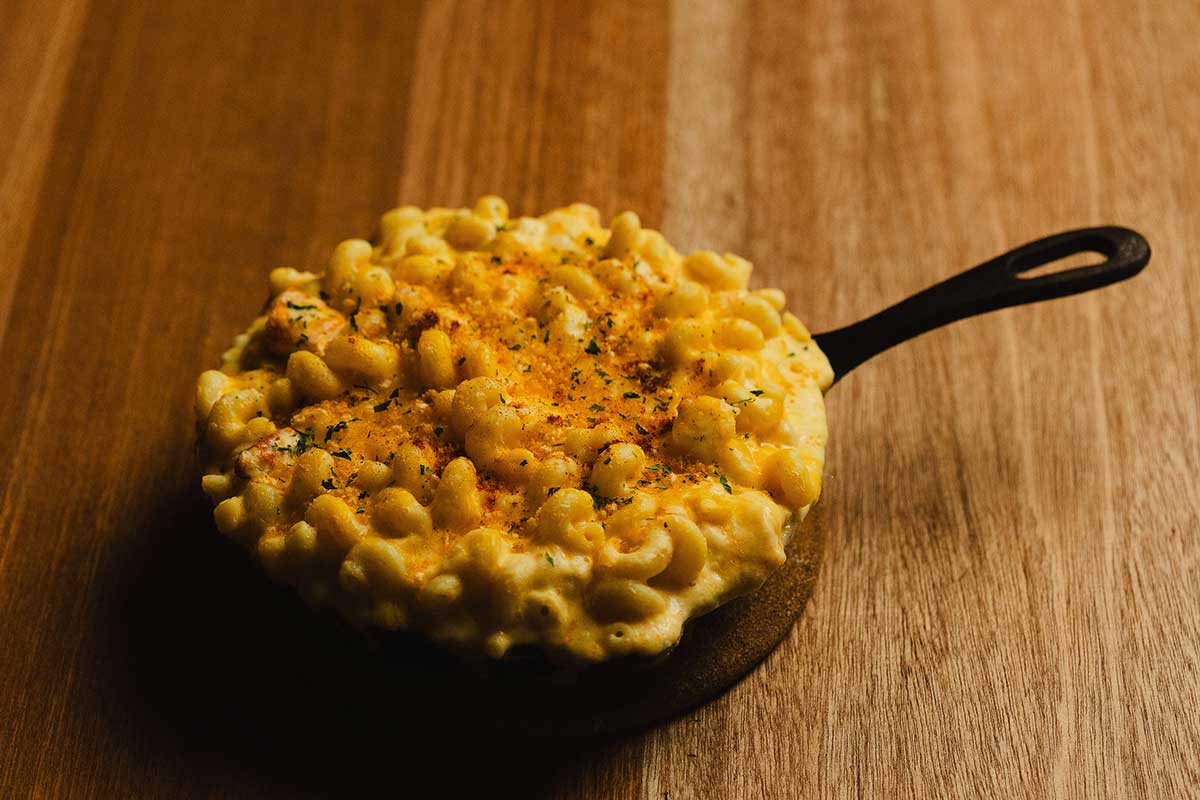 Lobster mac and cheese topped with seasoned bread crumb