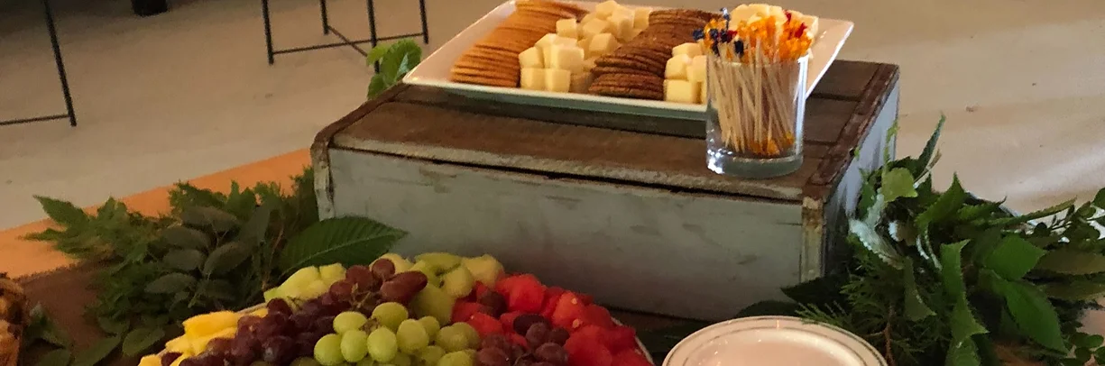 Cheese and fresh fruit on a  buffet table