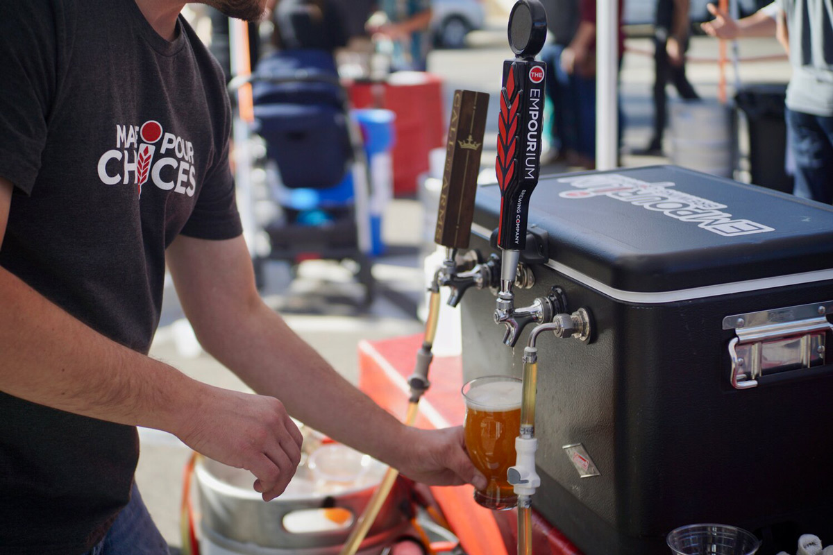 Empourium brewery at Fresh Hoptober Festival pouring a beer from a tap