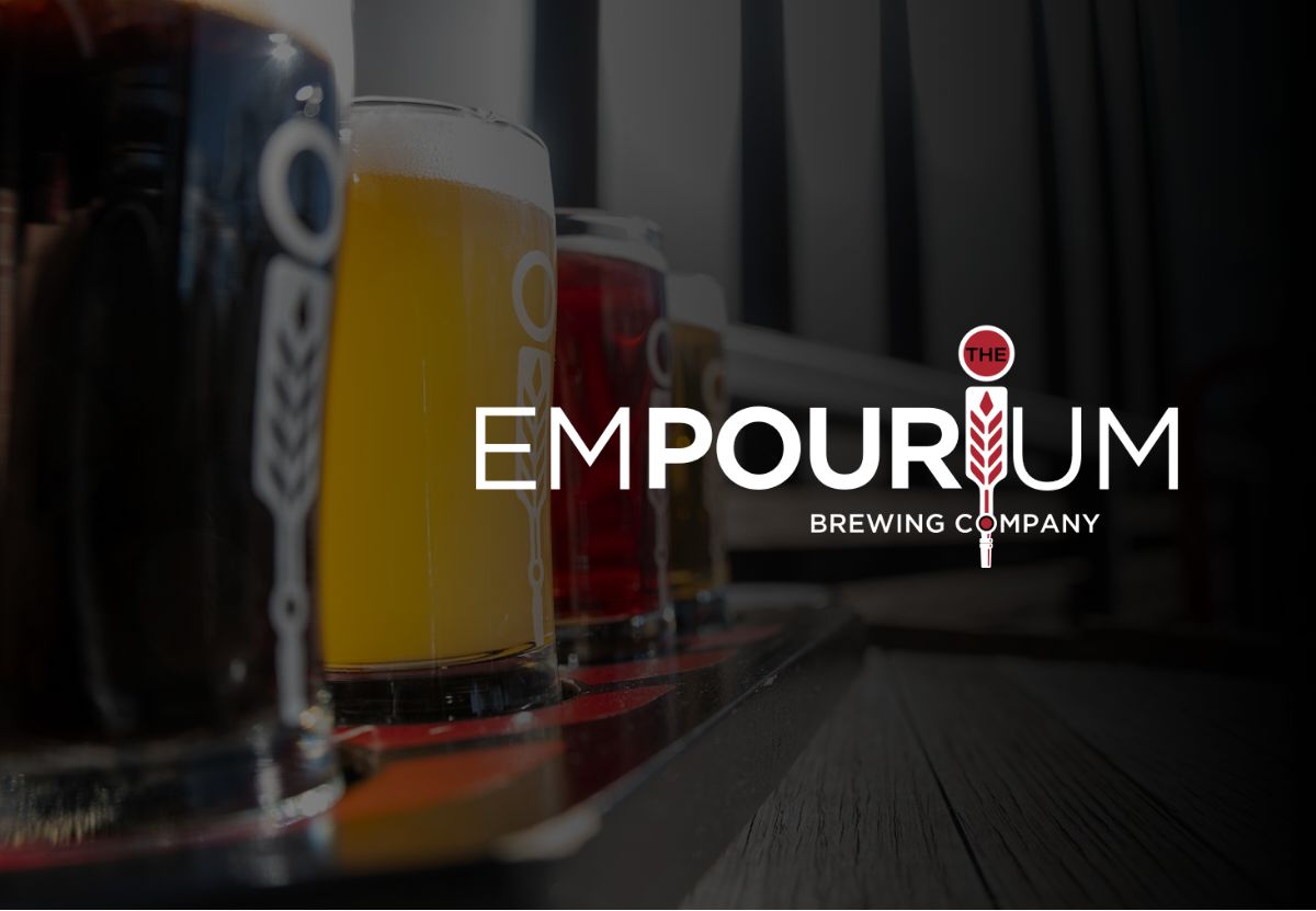glasses of beer with empourium brewery logo at front