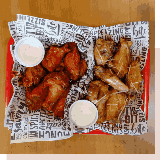 A tray of chicken wings and sauces
                