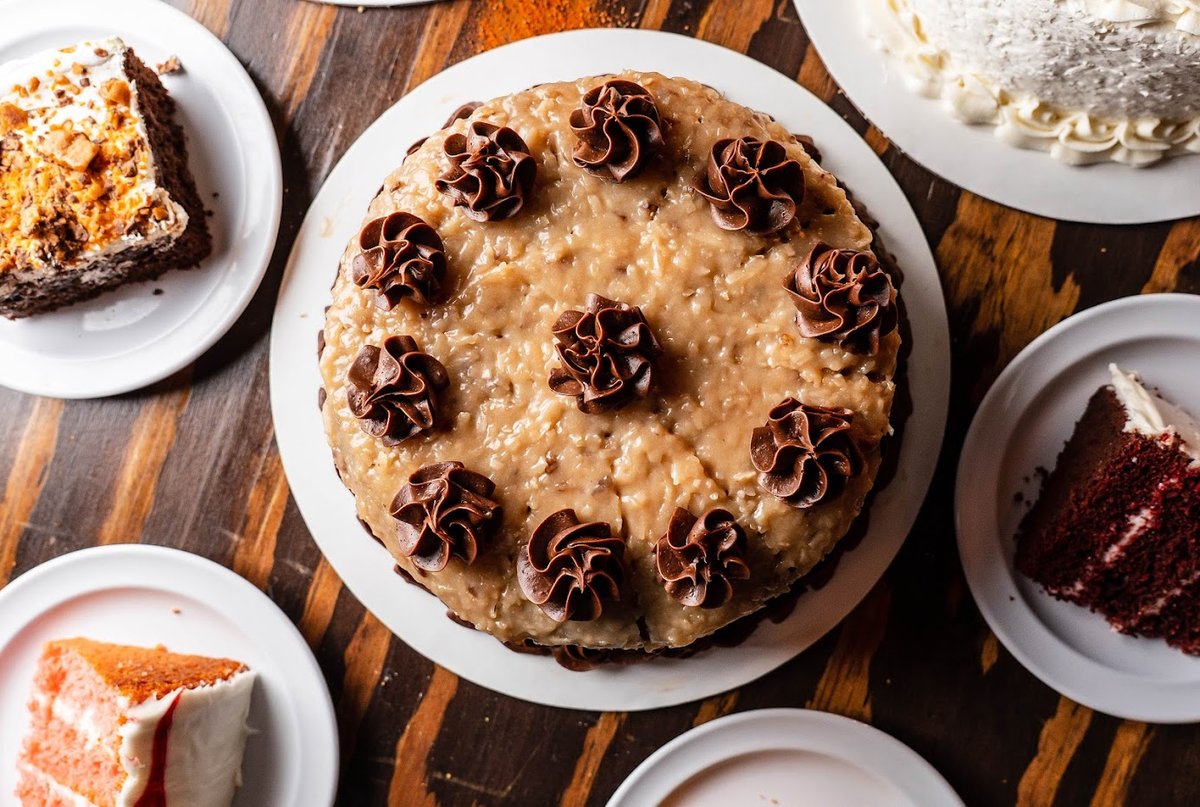 Multiple plates with served cakes, top view