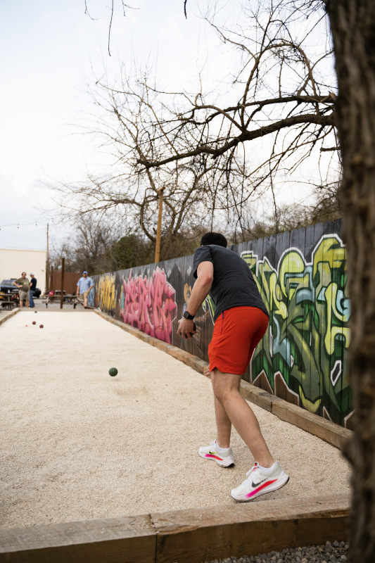 a person playing bocce ball