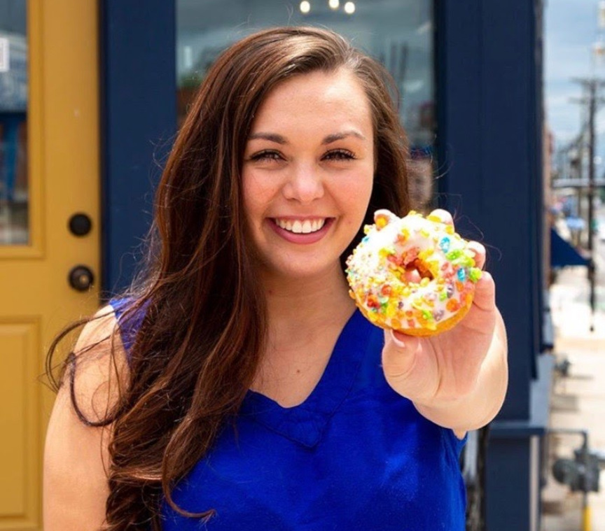 Girl holding a donut