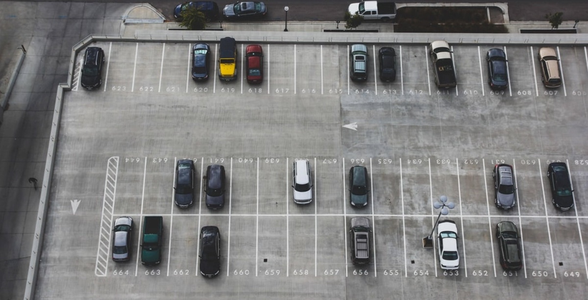 An aerial view of cars parked in a parking lot