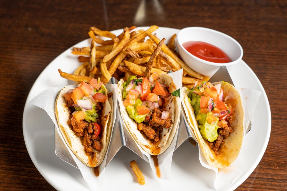 Tacos served with fries and tomato dip