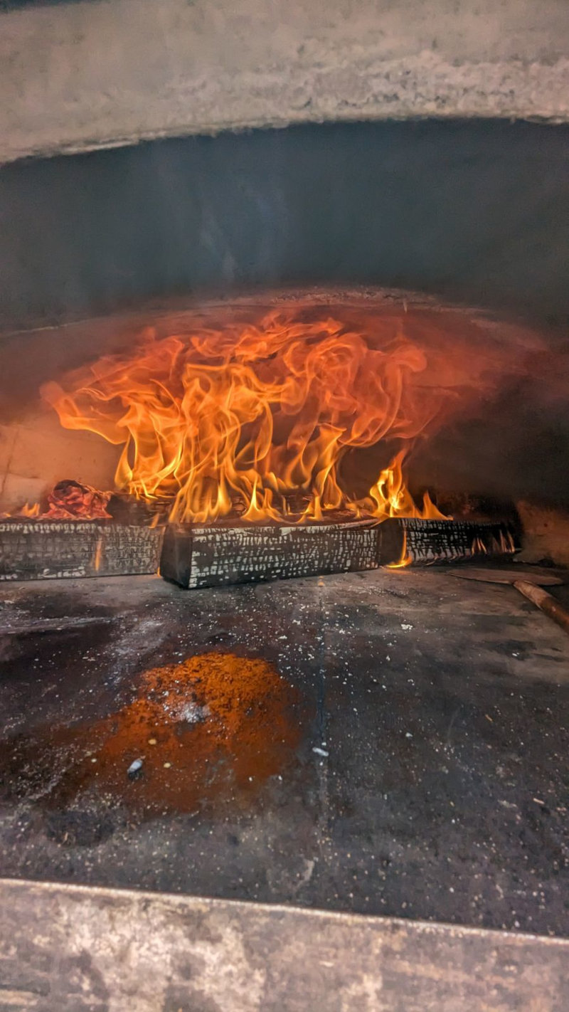 a fire in a stone oven