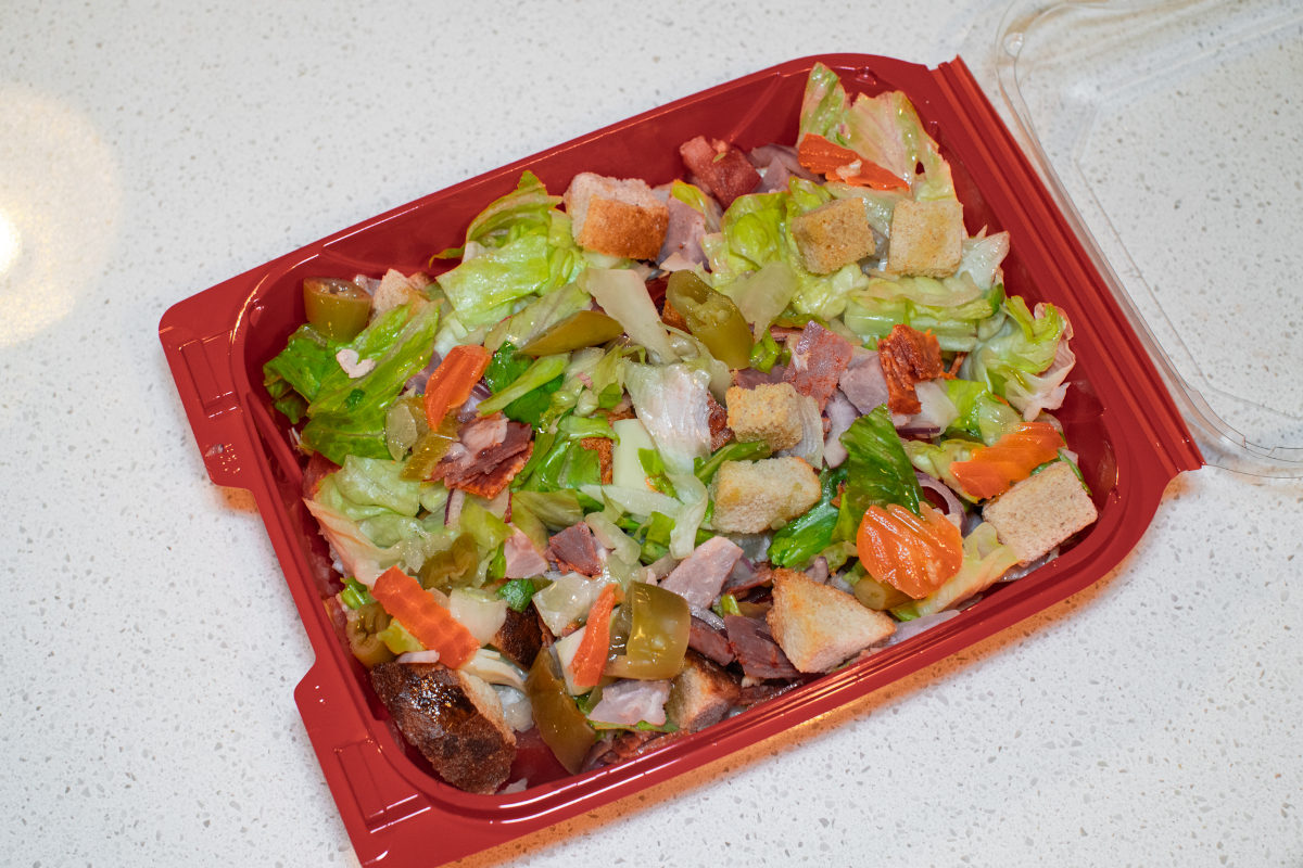 a salad in a red container