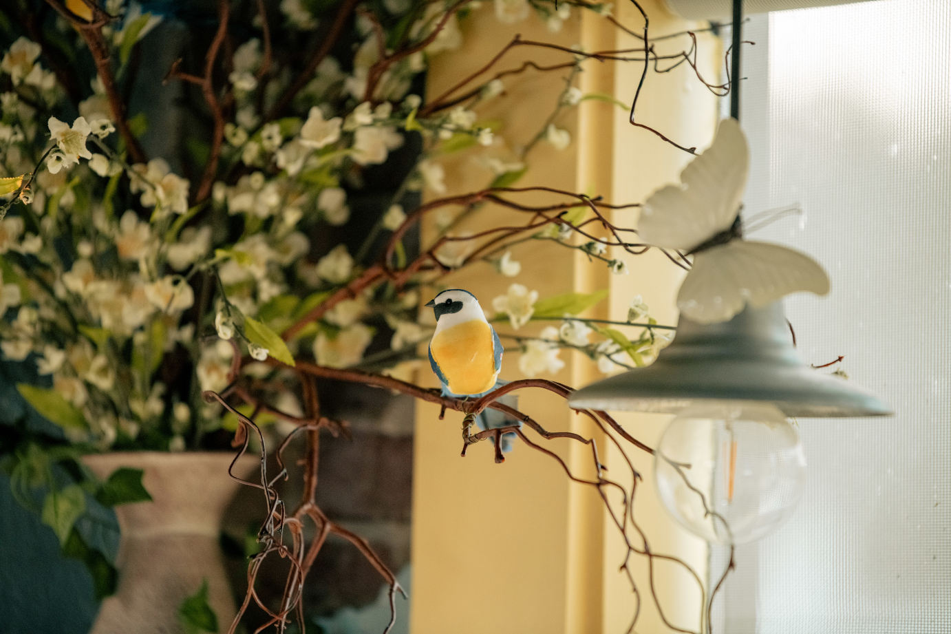 Decorative bird on a branch