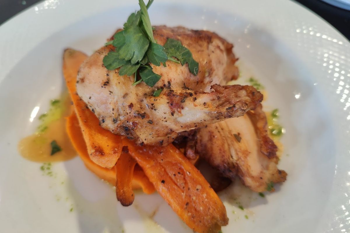 Roasted half chicken in fresh herbs with sweet potatoes