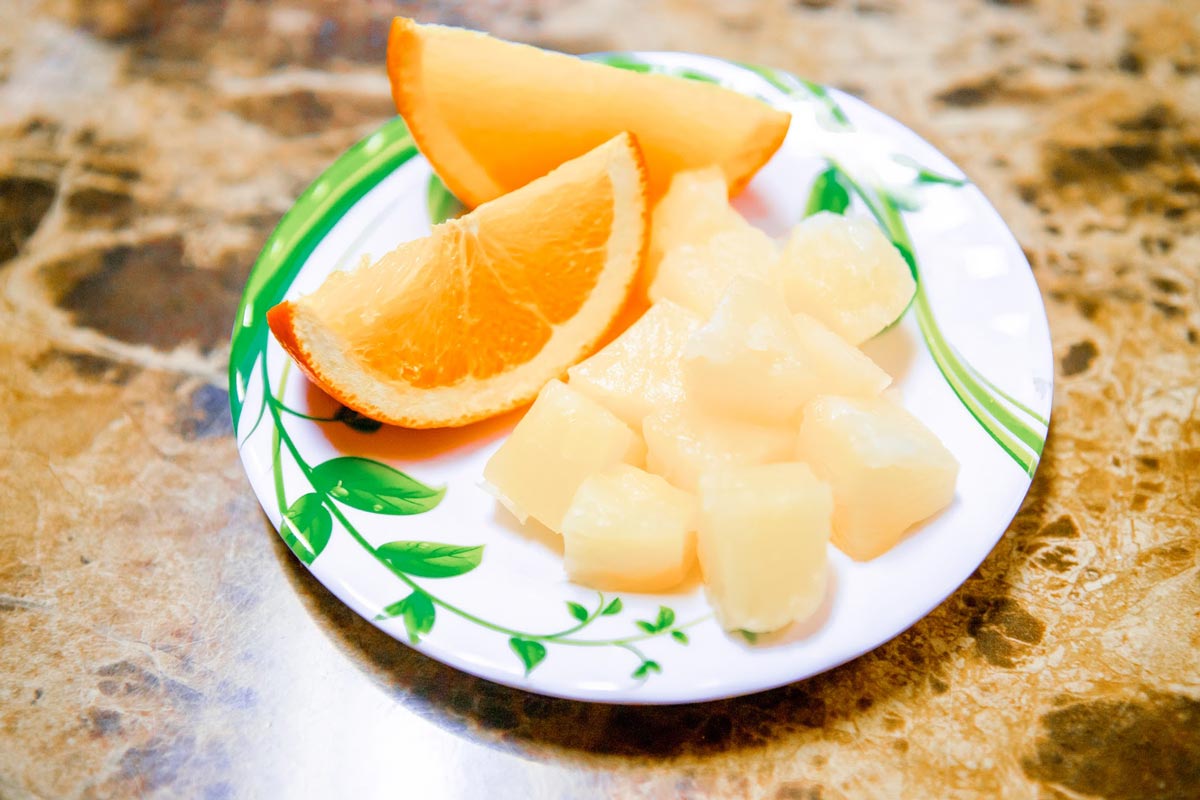 Orange and pineapple served