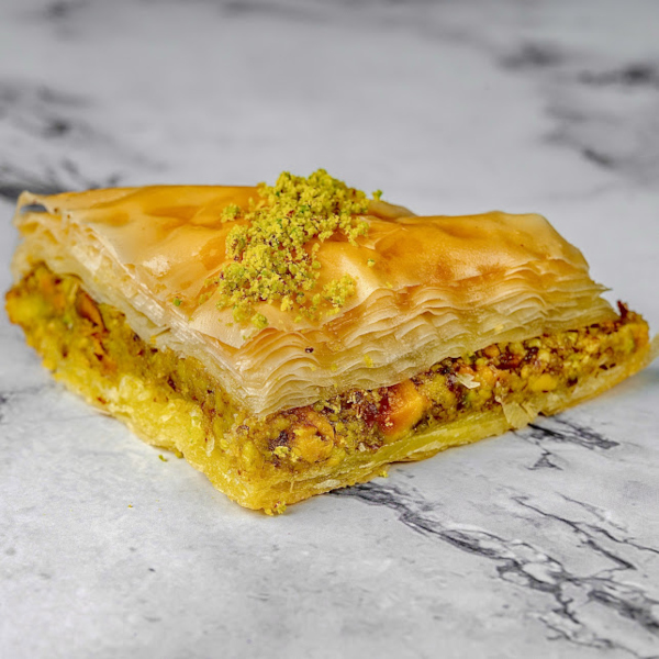 A piece of baklava on a marble table
