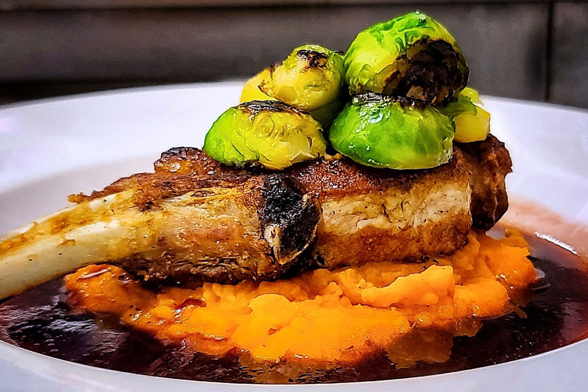 Berkshire Pork Loin Chop with brussels sprouts and mashed potatoes