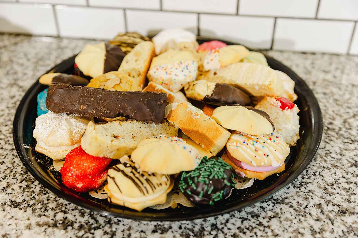 Various cookies and sweets on a tray, closeup