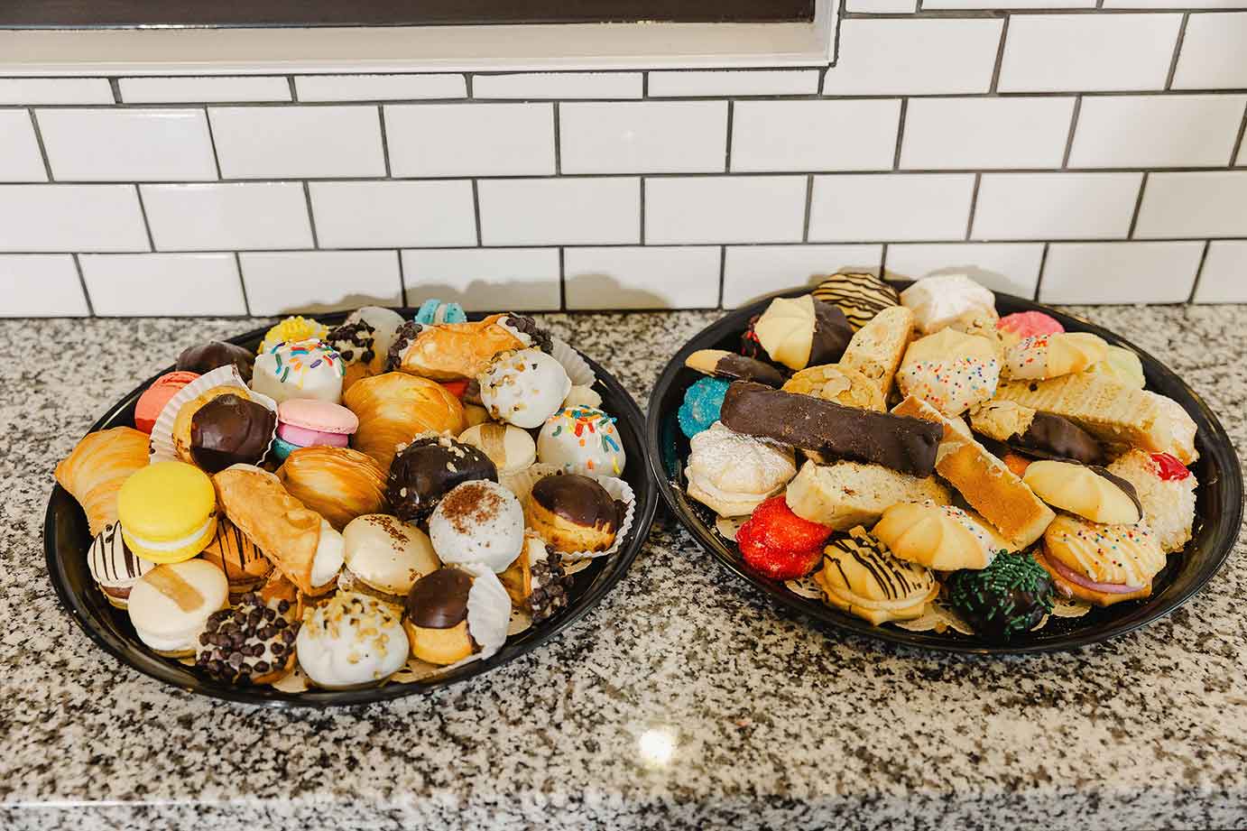 Two served trays of cookies and sweets