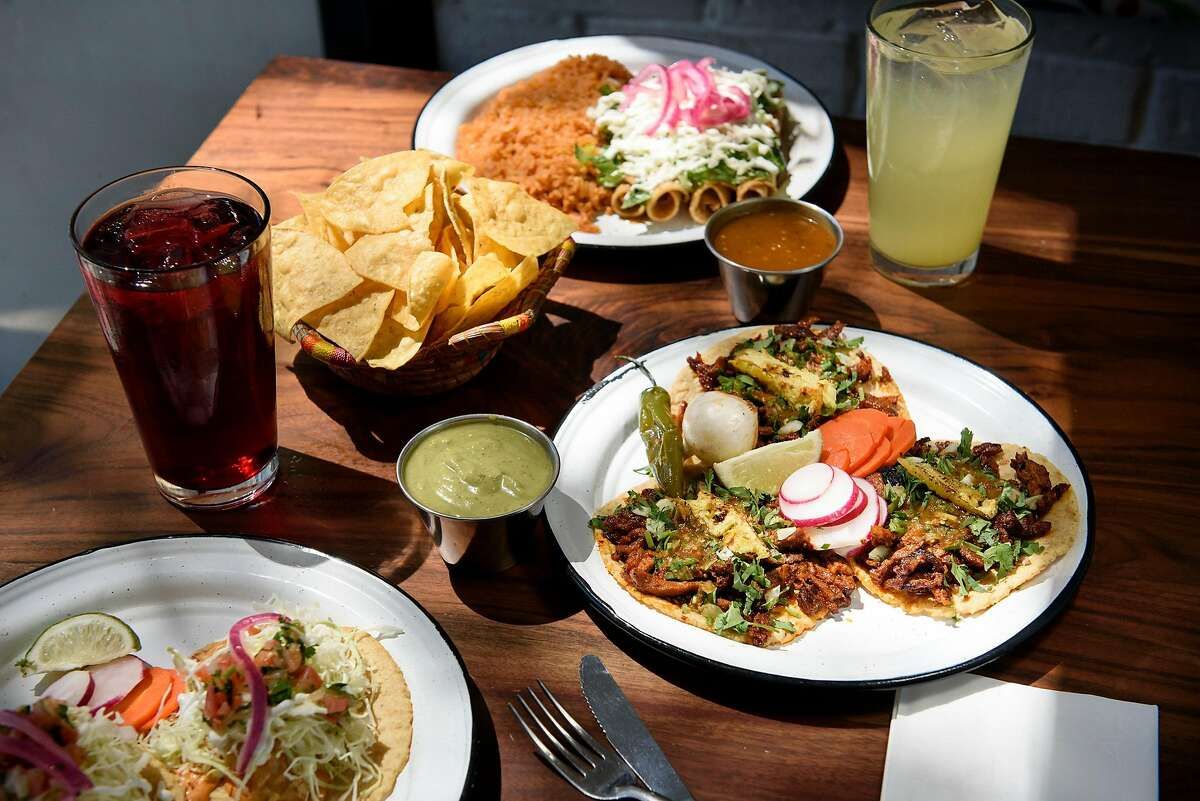 various dishes on the table with deeps and drinks