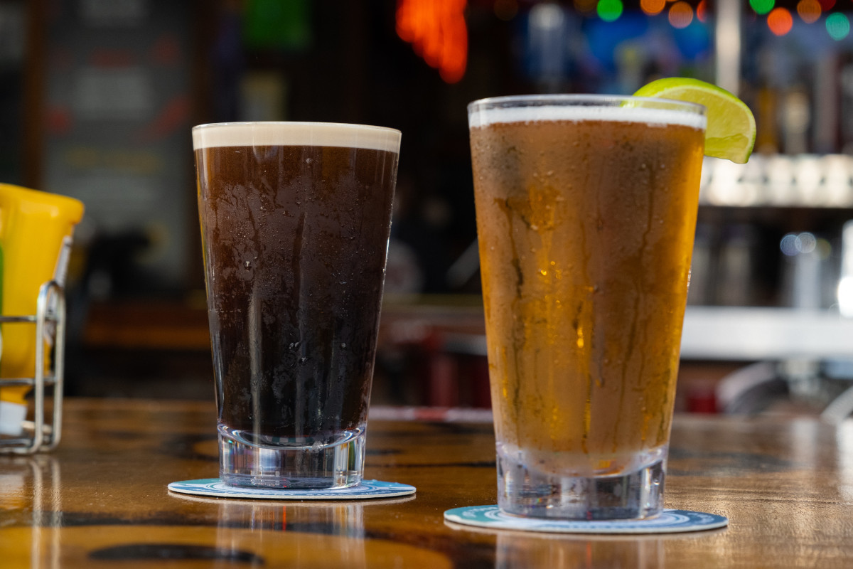 A glass of light and a glass of dark beer