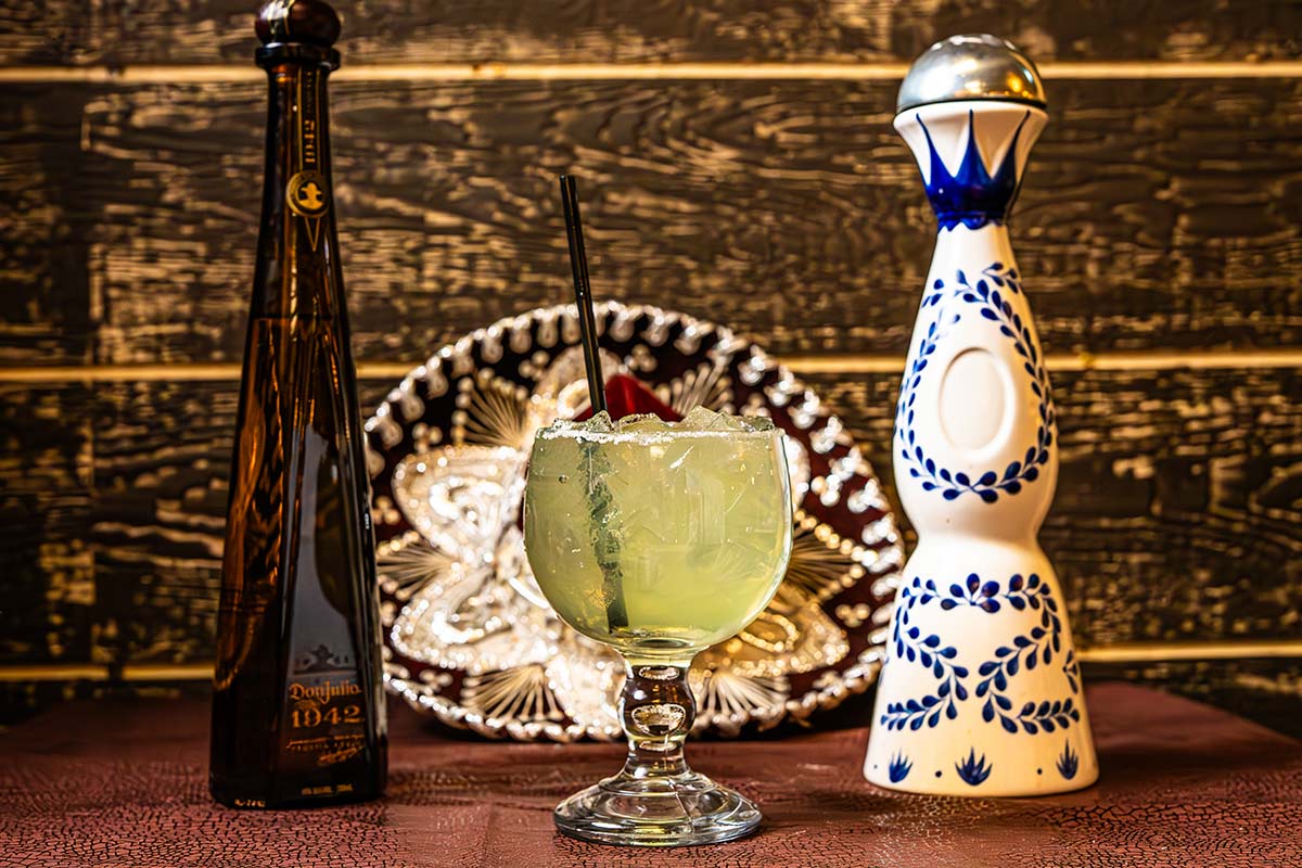 Tequila bottles and cocktails on the table