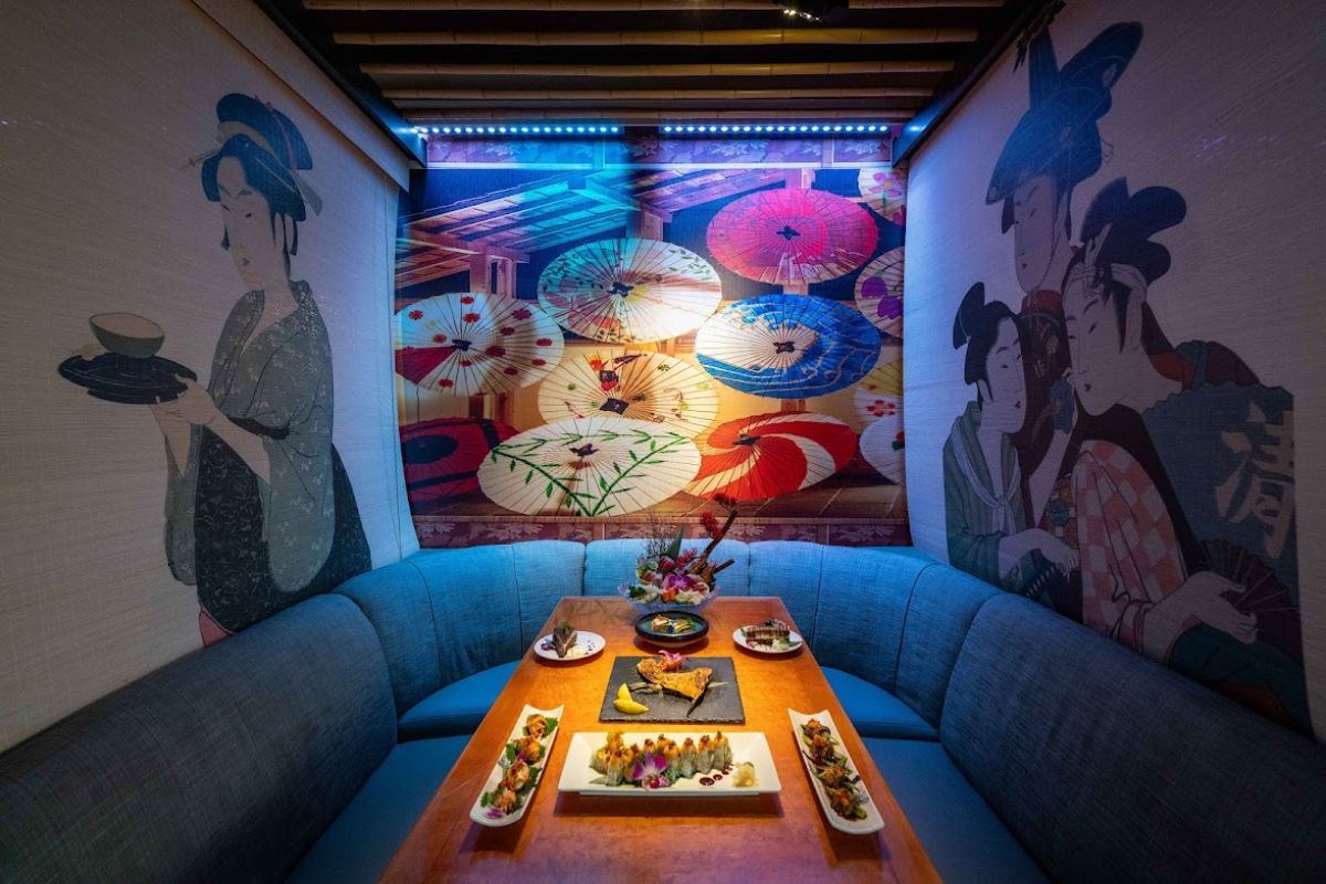 A dining room with a mural on the wall