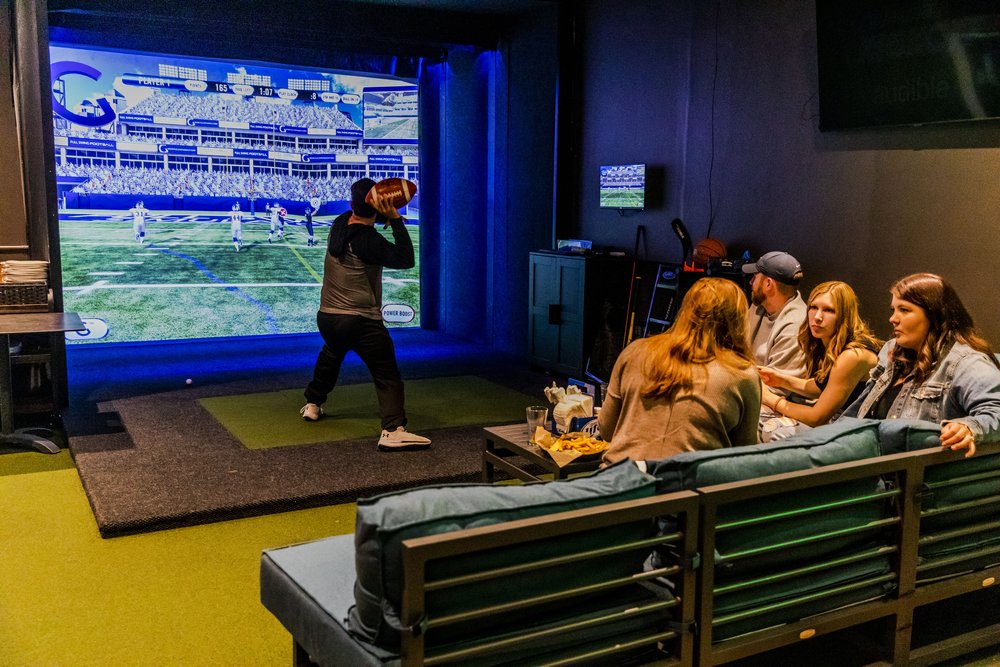 A group of people playing a video game in a room