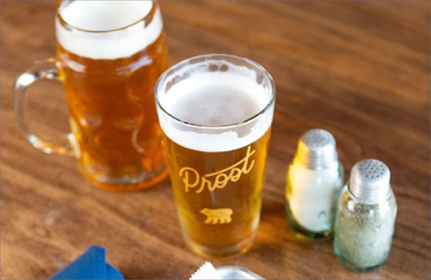 A glass and a mug of beer