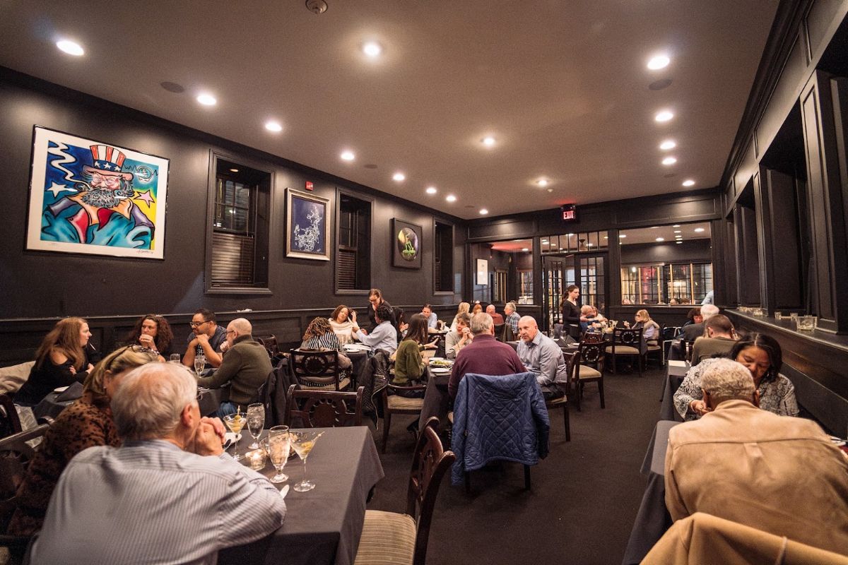 Dining room seating with artwork on the walls