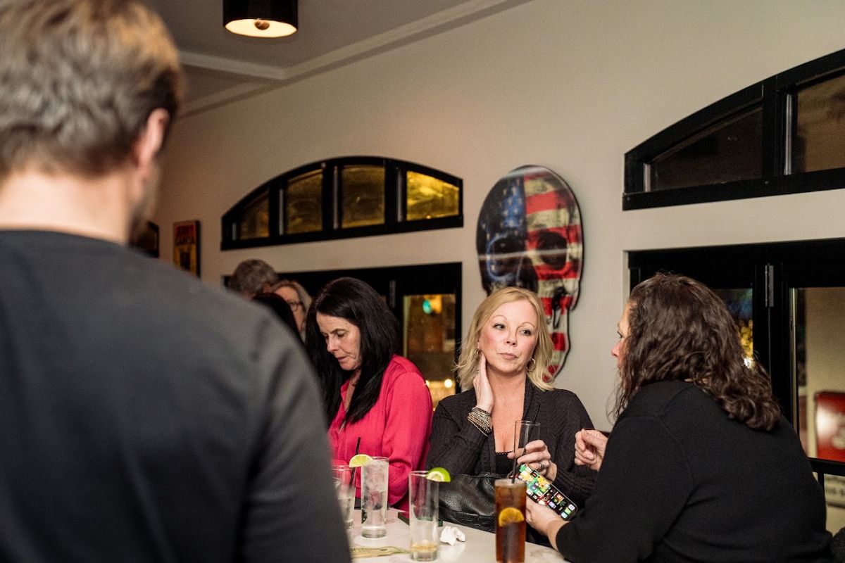 Guests enjoying drinks in the Second Story lounge