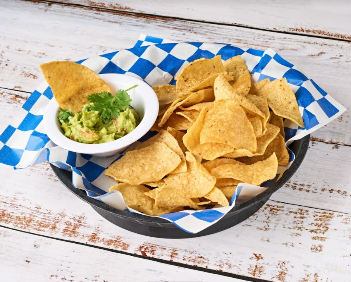 Corn chips with guacamole dip