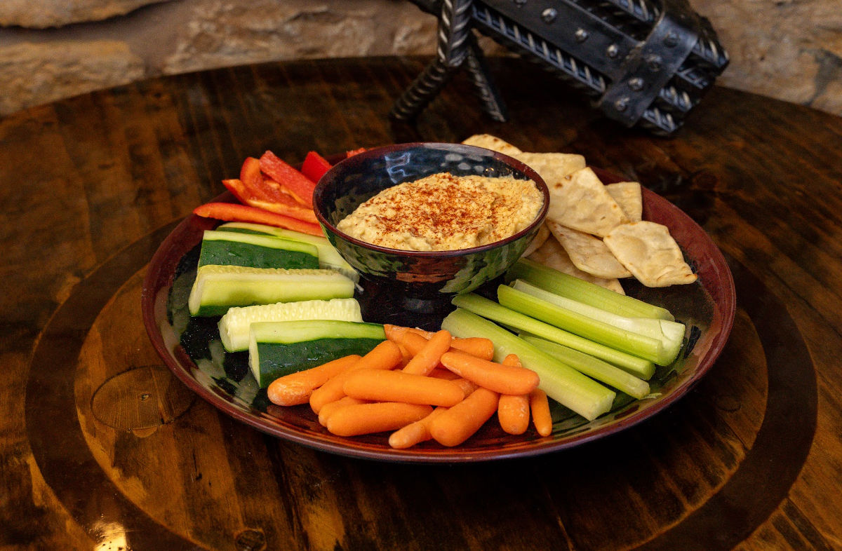 a plate of vegetables and dip