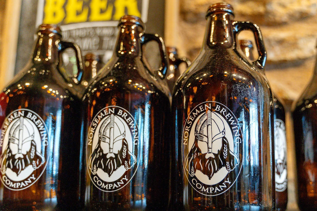 the brown glass bottles with a logo on them