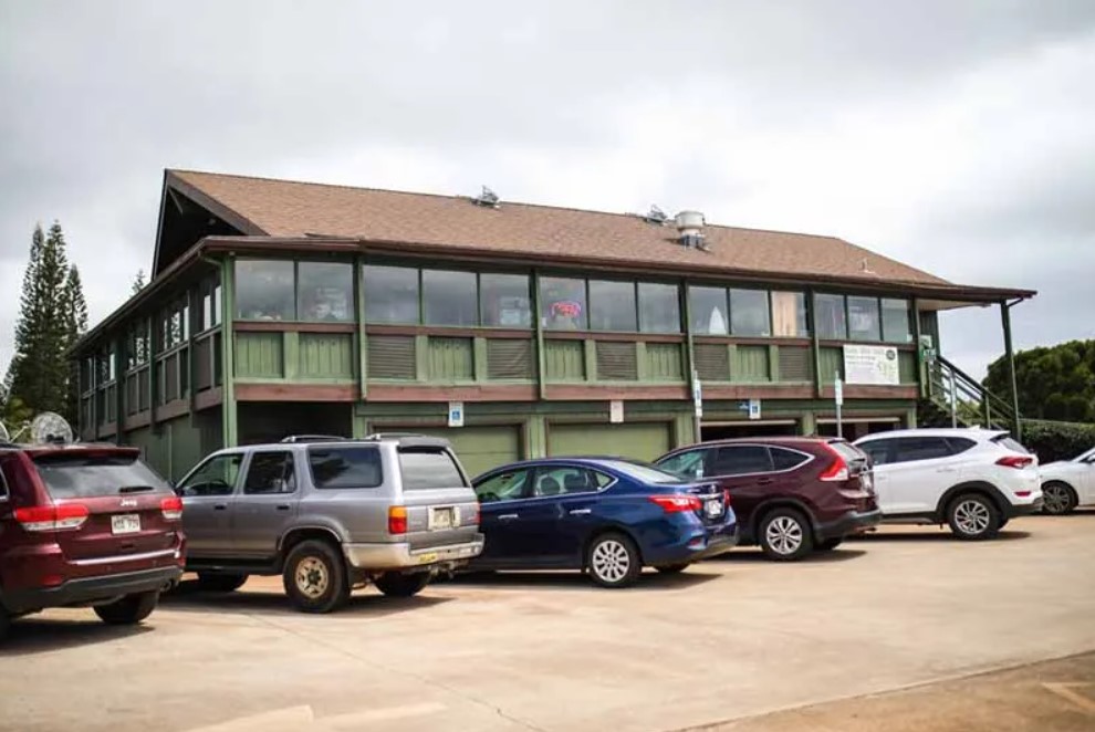 front of the restaurant building and the parking lot