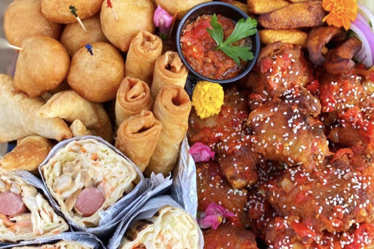 Holiday platter, with shawarma, spring rolls, curry chicken , samosas, puff pastries, and potatoes