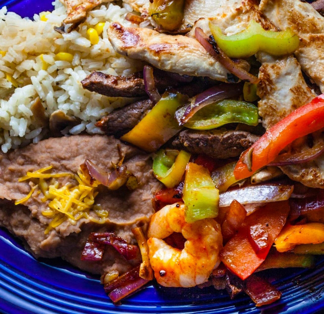 a plate of food with rice and meat