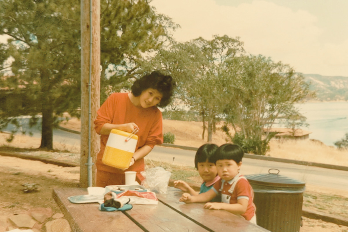 family sitting at a park