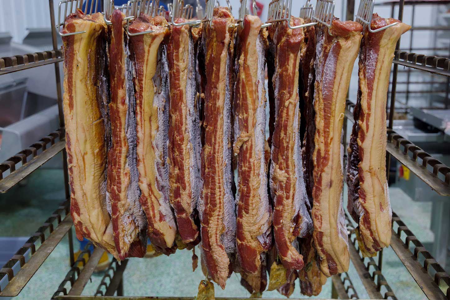 Bacon hanging on a rack