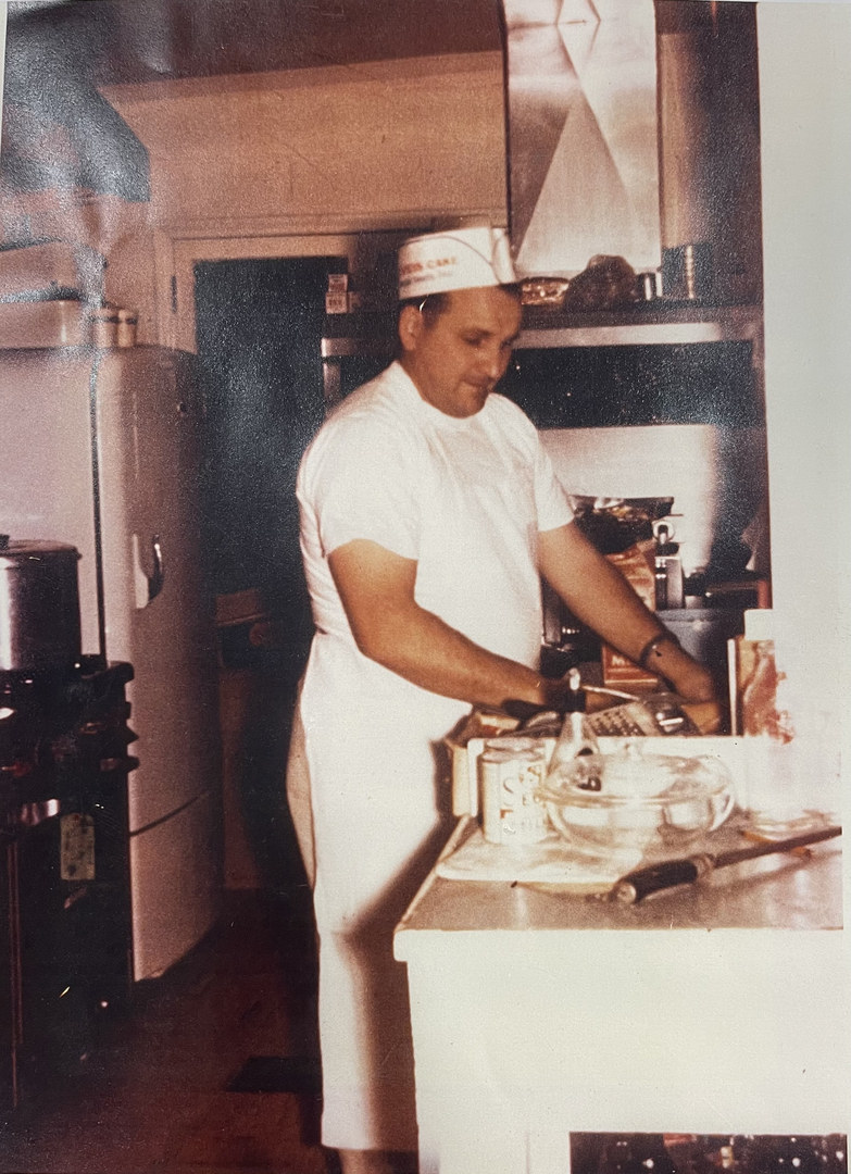 A person in a white chef's hat