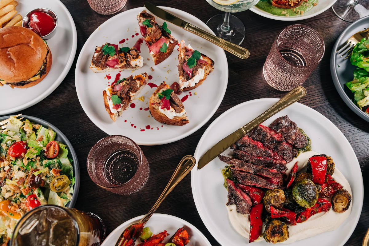Various plates of food on a table.
