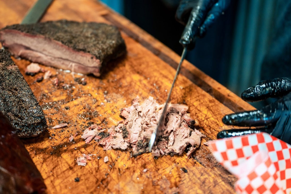 Angled view of Meat choping on the cut board.
