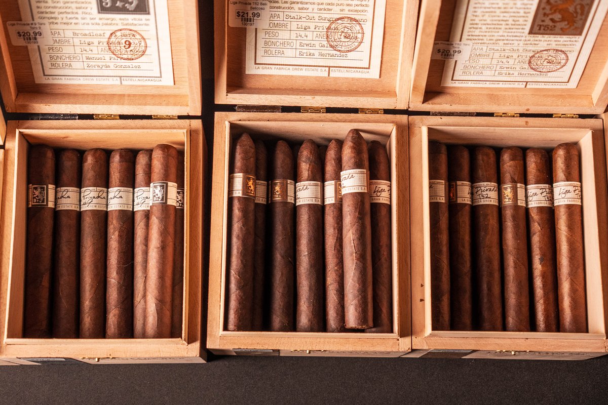 a group of cigars in wooden boxes