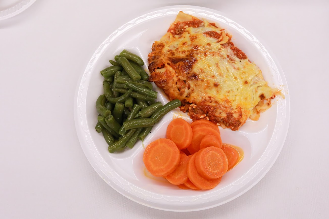 Carrots, Green Beans, and Lasagna served on the plate