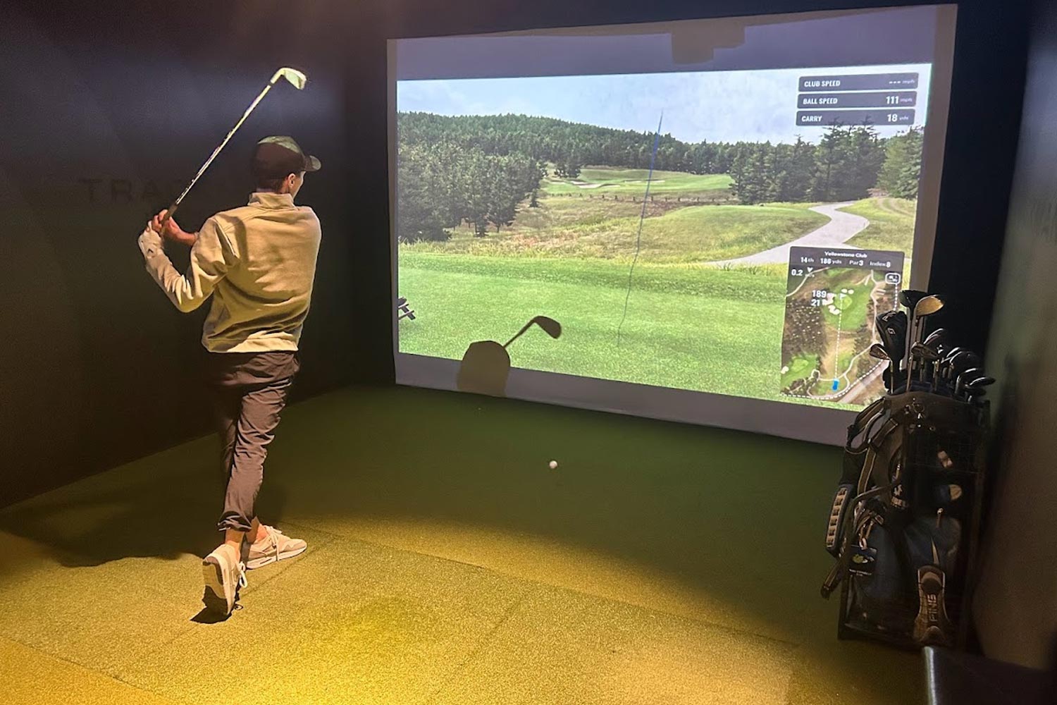 A person playing virtual golf